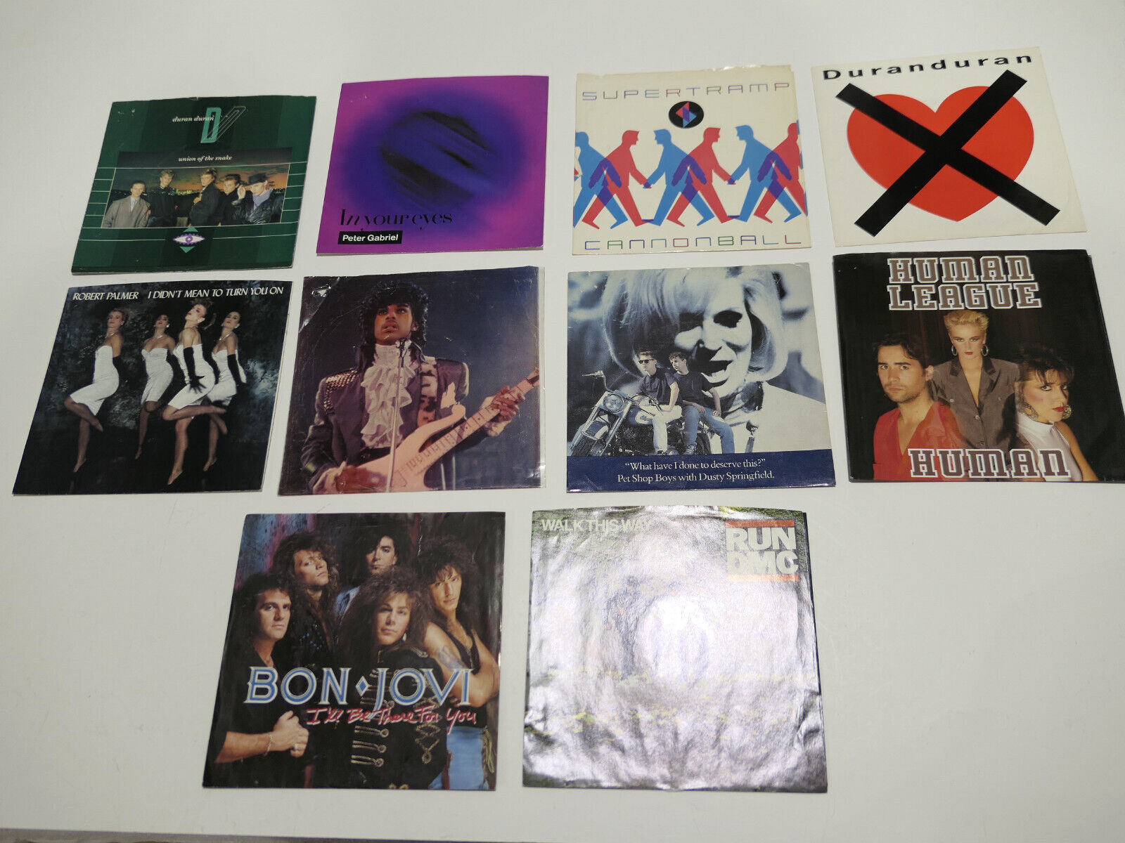 10X 7″ SINGLE PICTURE SLEEVES (NO DISC)PRINCE,DURAN,BON JOVI,PALMER,RUN DMC