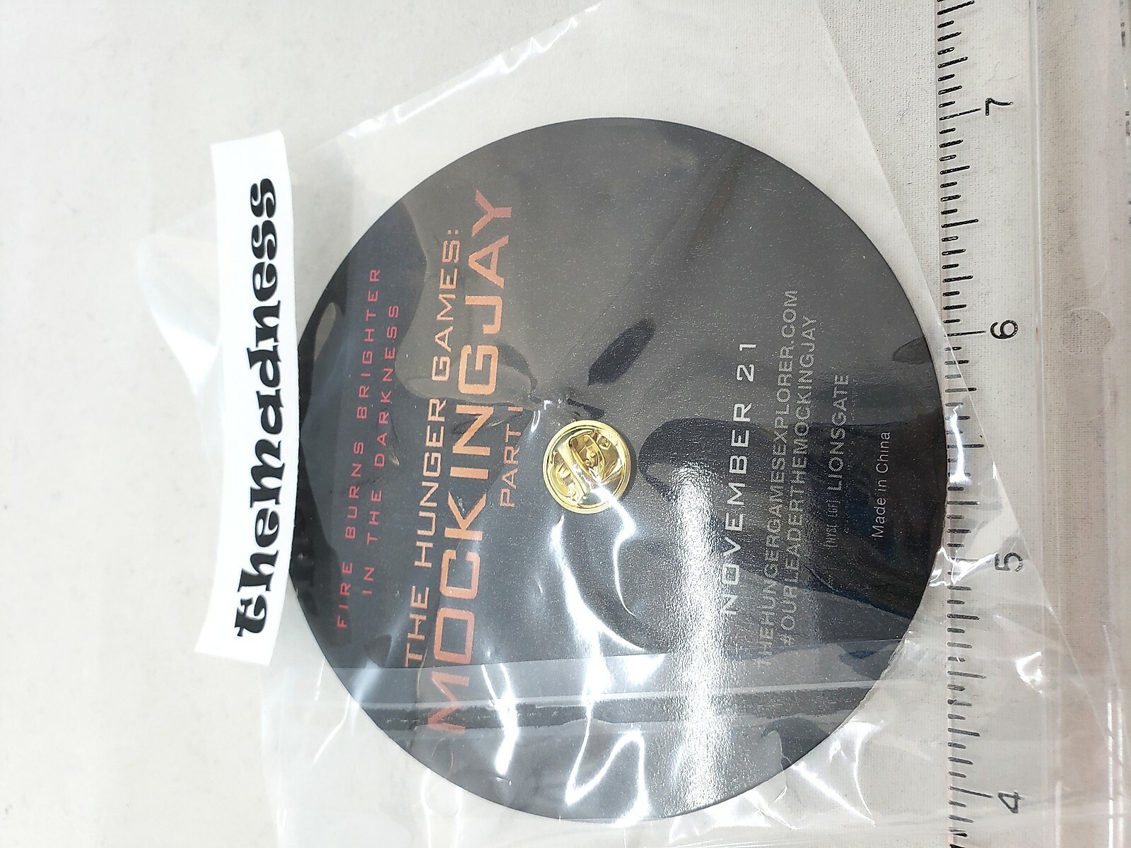 New Samsung Galaxy Promo Hunger Games Mockingjay Pin Suzanne Collins Photo