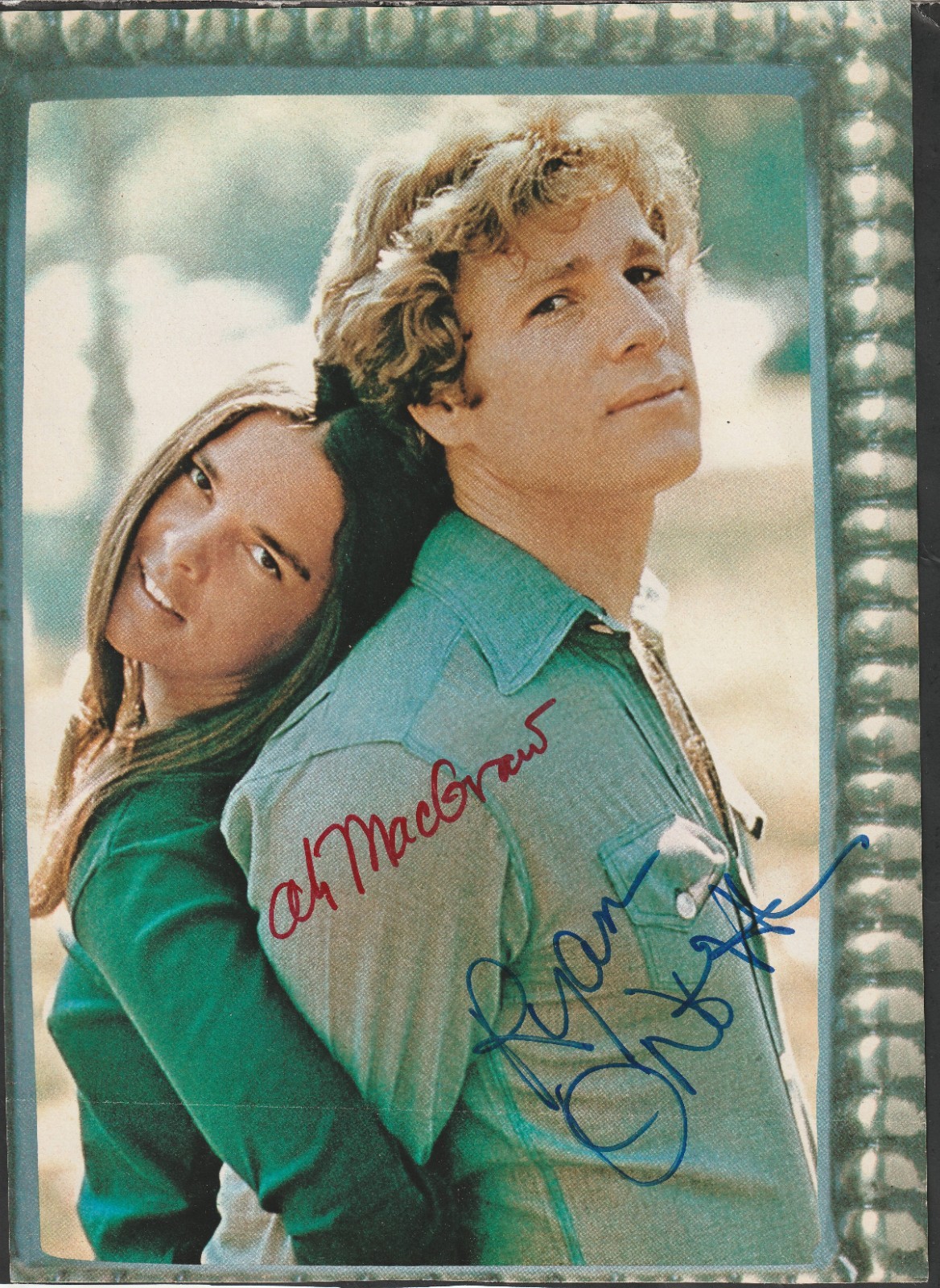 Ali MacGraw and Ryan O’Neal Autographed “Love Story” Photo (cut from magazine)