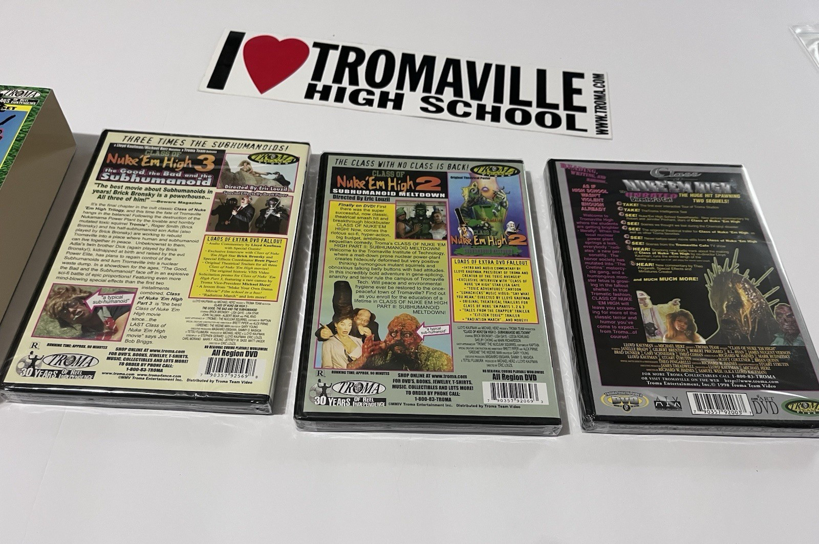 SIGNED Lloyd Kaufman Nuke ‘Em High Spill-Ogy Box Set + RARE Tromaville Sticker