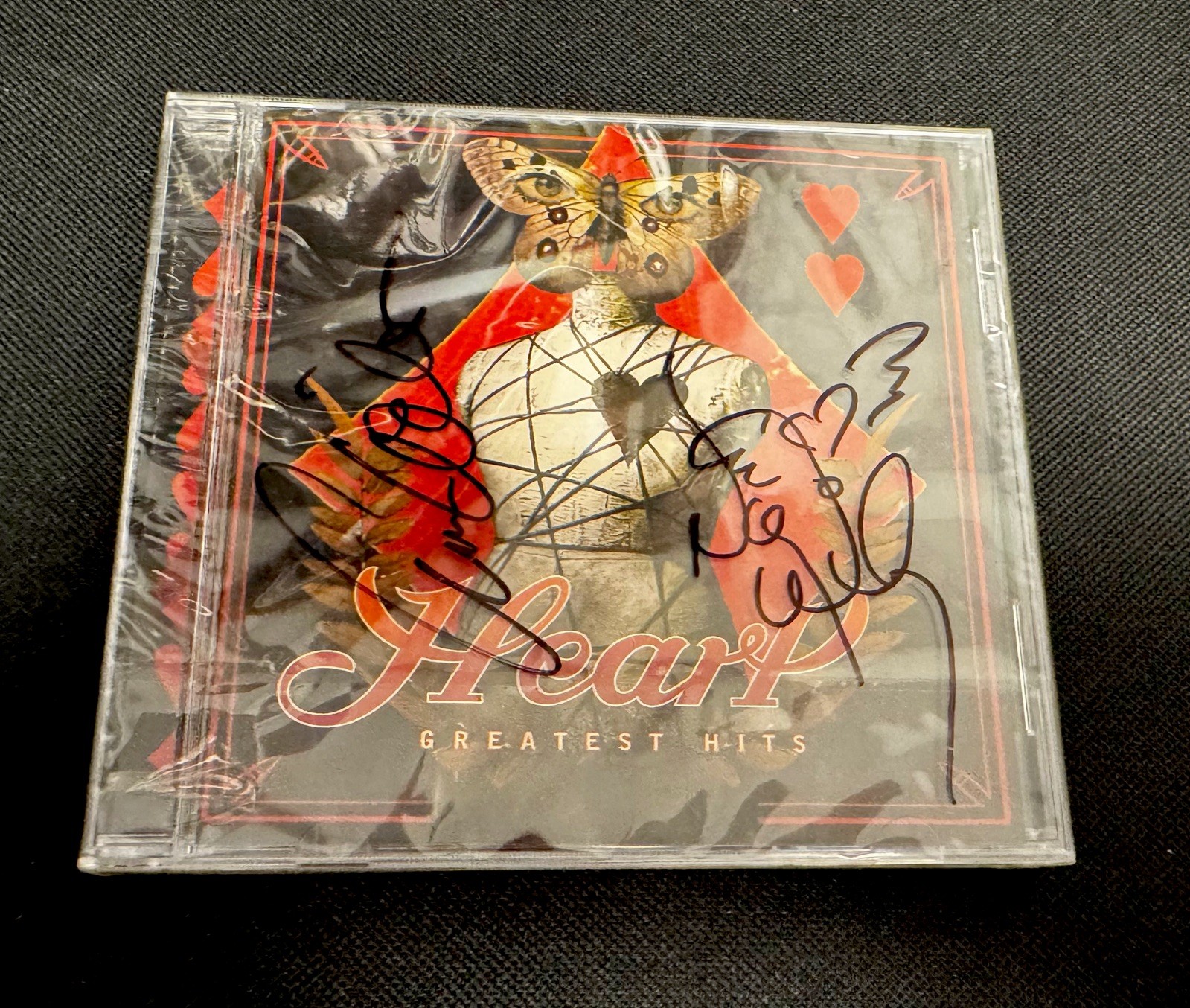 AUTHENTIC Signatures of Ann & Nancy Wilson of Heart on CD Heart Greatest Hits