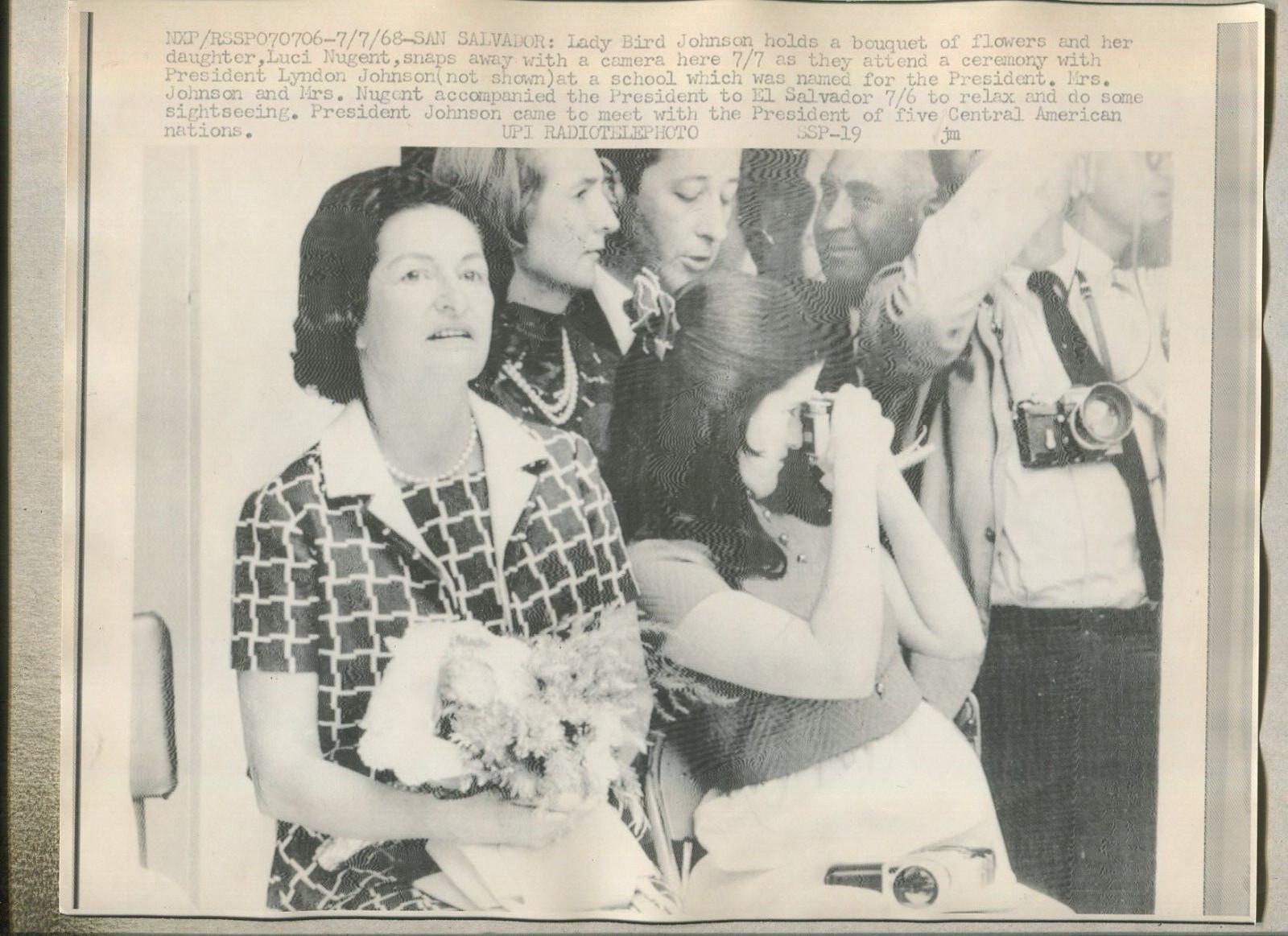 Ladybird Holds Bouquet As Luci Takes Photos Photo Promo Press Photo R1
