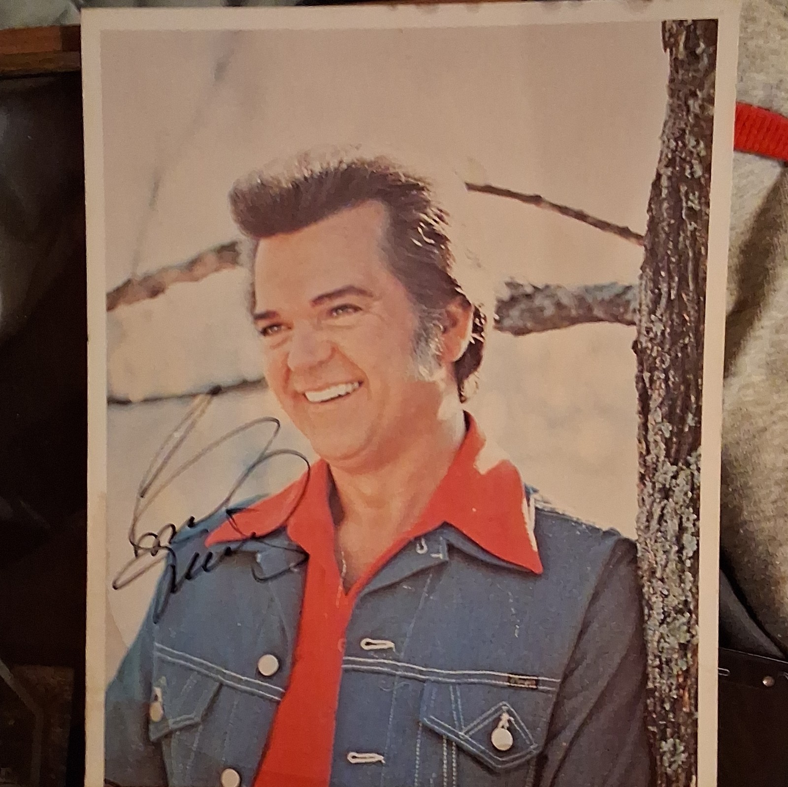 Conway Twitty 8×10 Signed Photograph in Black Ink. 2 unknown Autographs on back