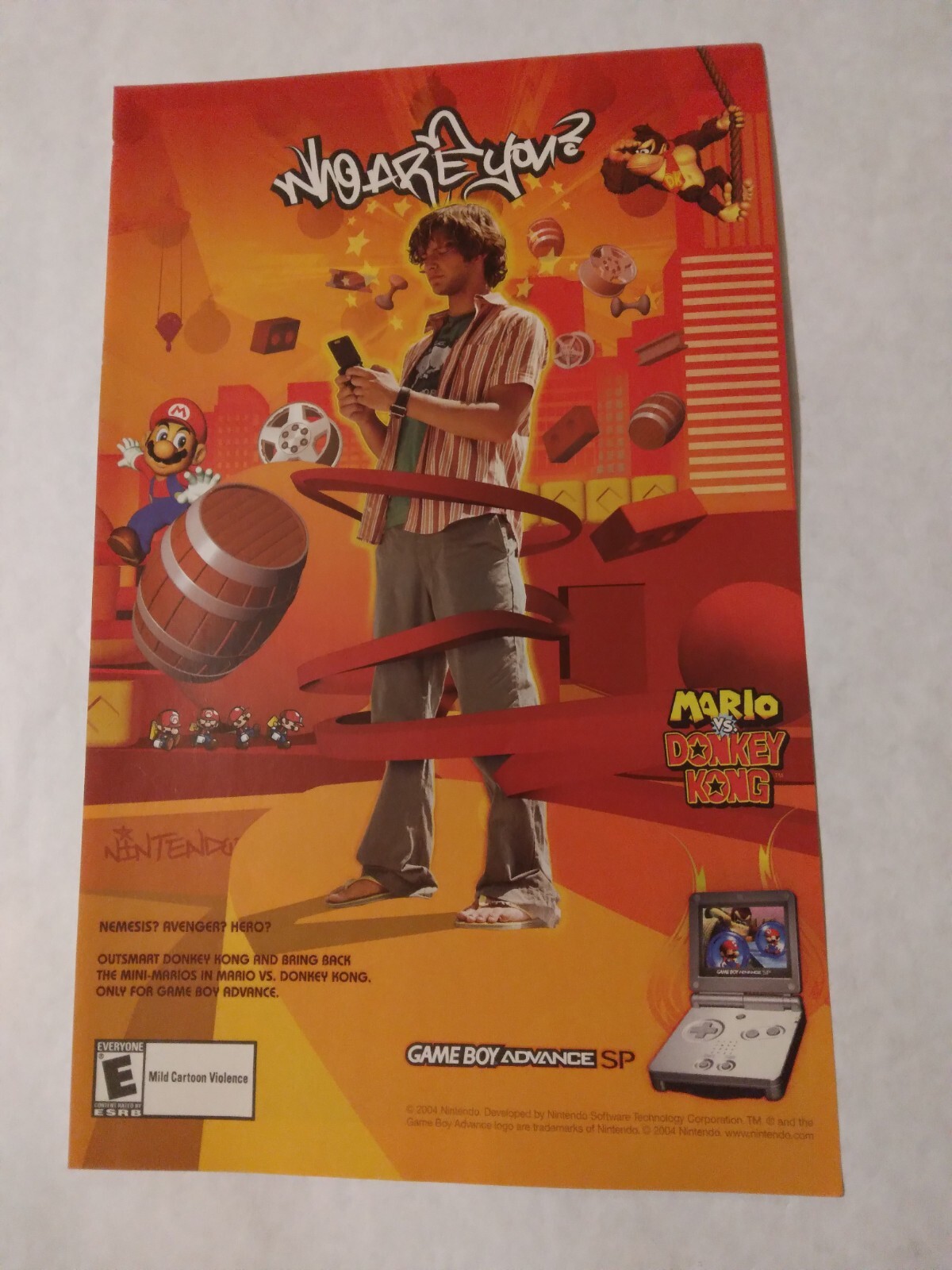 2004 Video Game Print Ad “WHO ARE YOU?” MARIO vs. DONKEY KONG – GBA SP