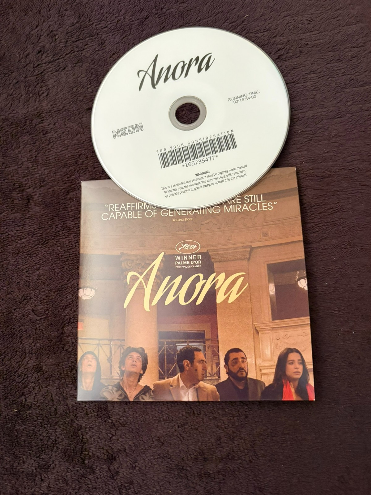 ANORA Oscar DVD and sleeve with cast, Mikey Madison, Yura Borisov, Sean Baker