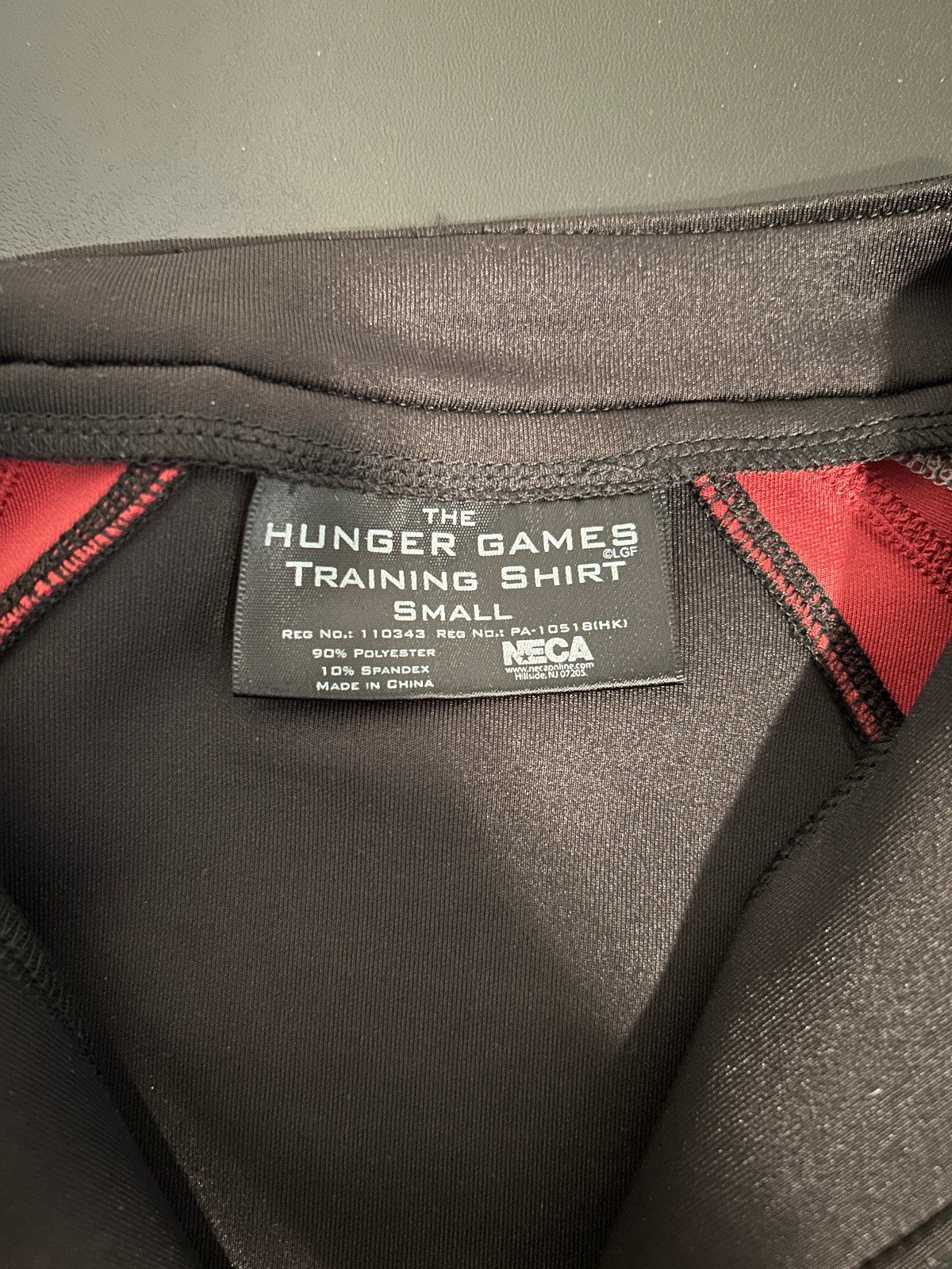 HUNGER GAMES TRAINING SHIRT Authentic Prop replica Katniss District 12 NWT SMALL