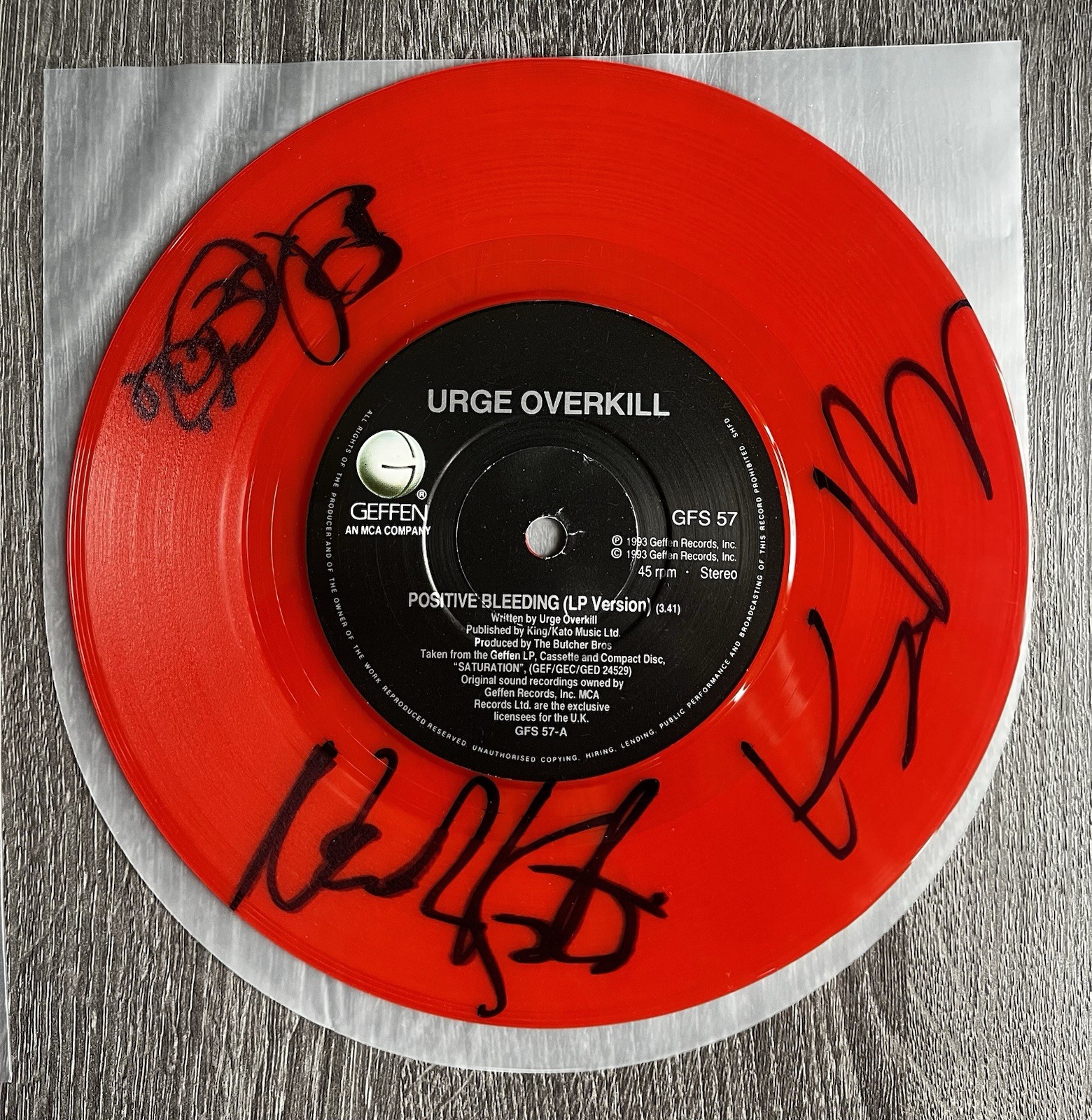 *Autographed* Urge Overkill Positive Bleeding coloured 7-Inch single (signed)