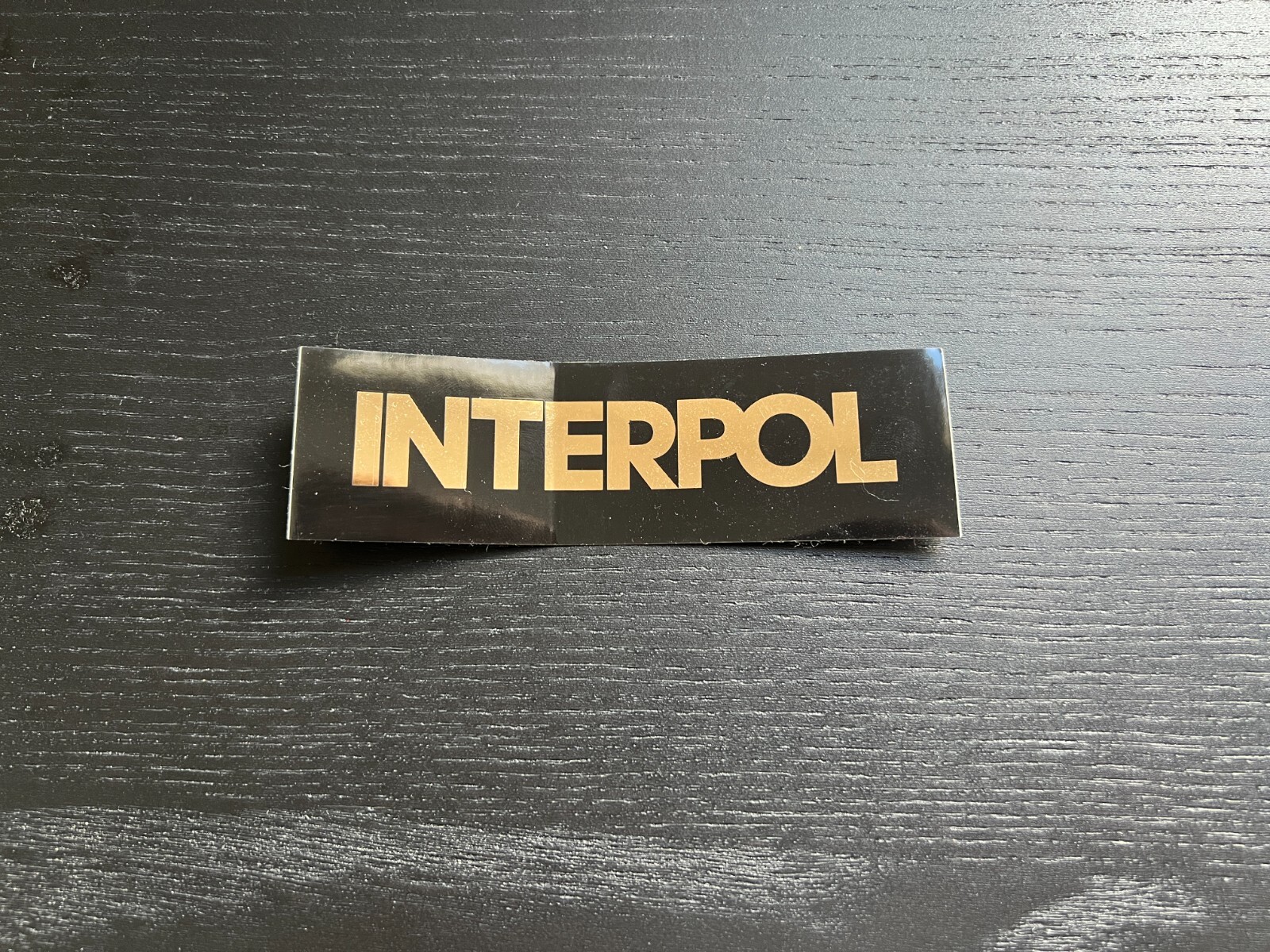 Interpol band stickers from Our Love To Admire album, black with gold lettering