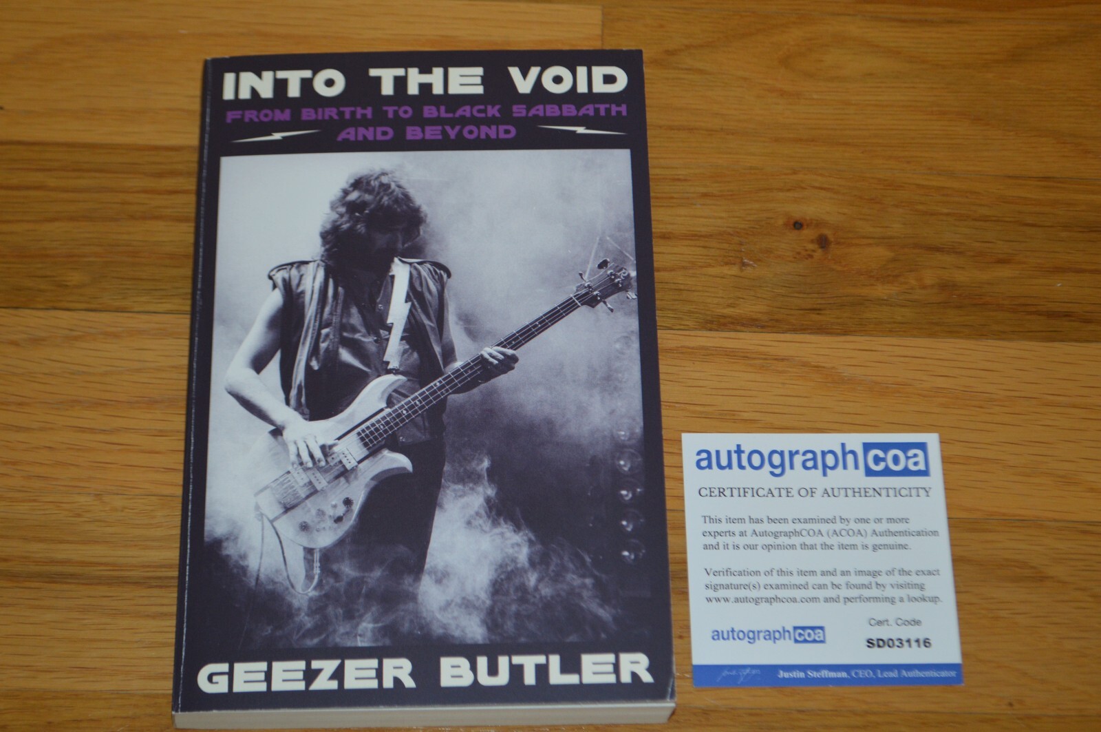Geezer Butler Autographed “Into The Void” Softcover Book with AUTOGRAPH COA
