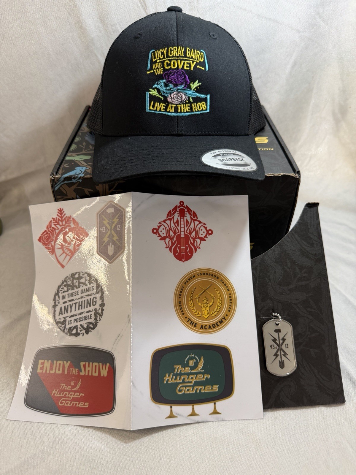 The Hunger Games Hat Exclusive Merchandise – Box, Hat, Dog tag & Stickers Only