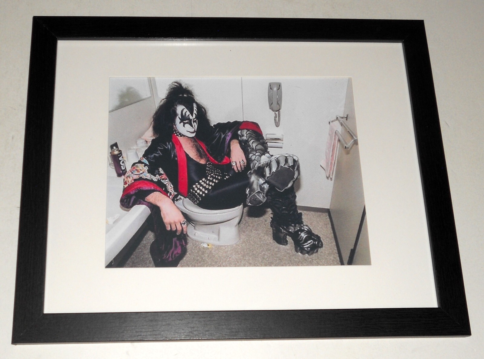 Framed Gene Simmons of KISS on the toilet in 1977 Japan Tour color 16″x13″