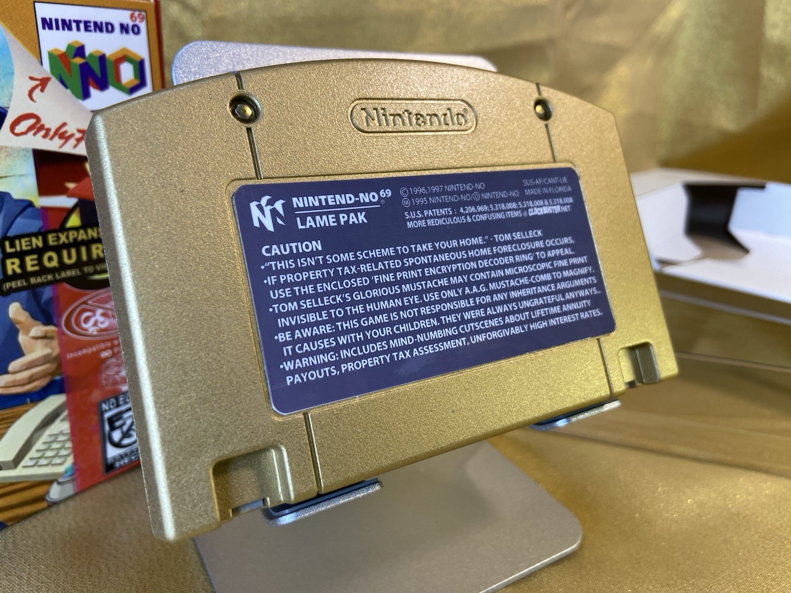 Tom Selleck Reverse Mortgage GOLD w/ contract Nintendo 64 style collectible