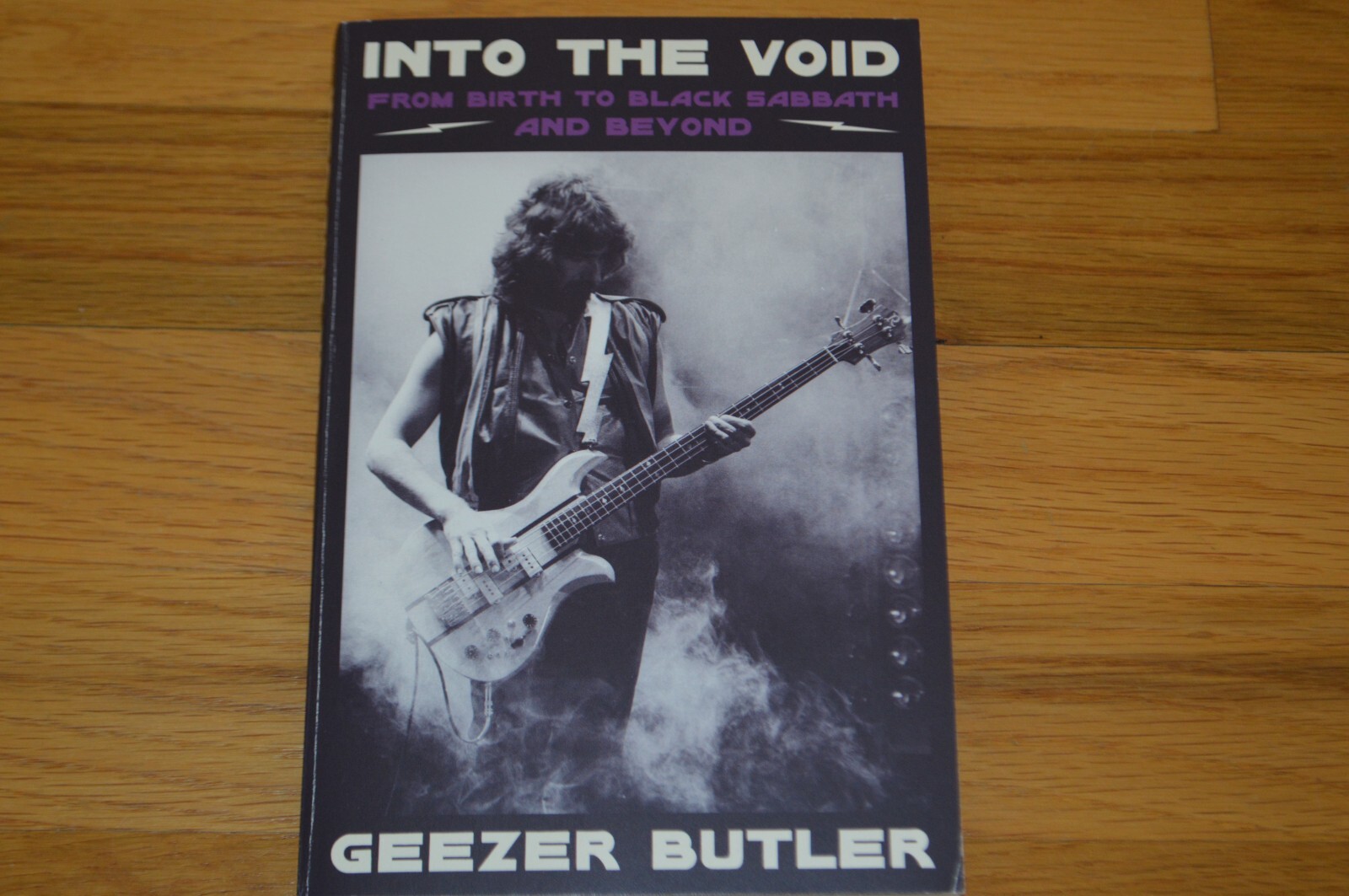 Geezer Butler Autographed “Into The Void” Softcover Book with AUTOGRAPH COA