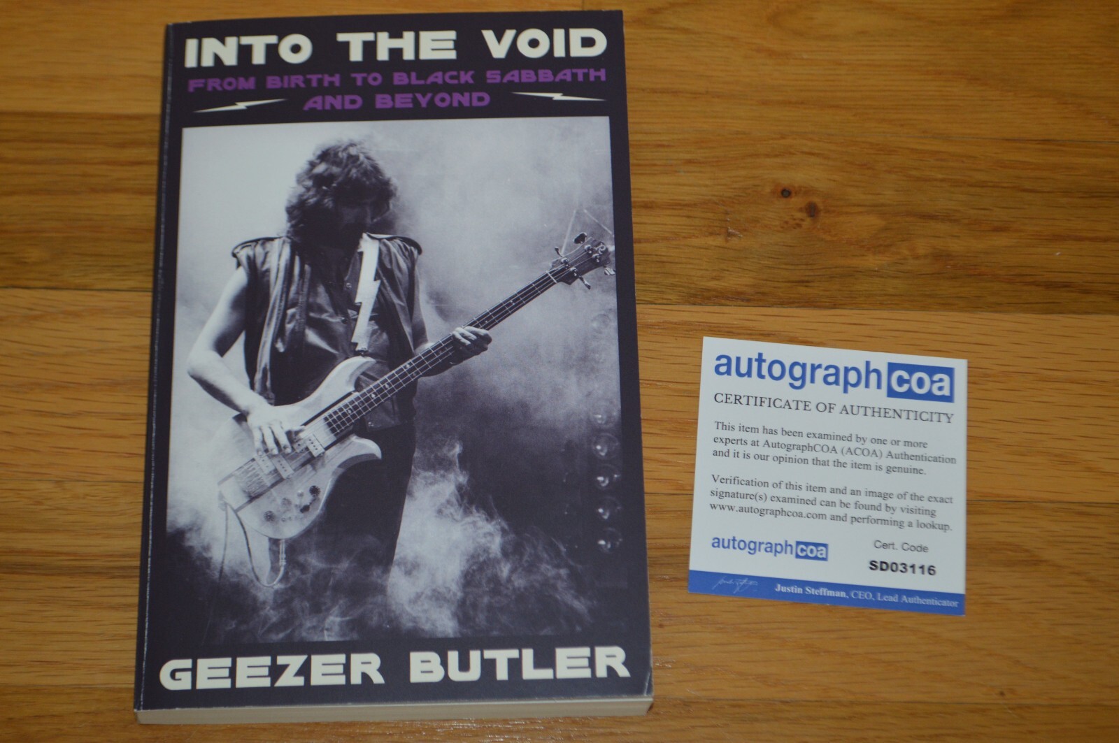 Geezer Butler Autographed “Into The Void” Softcover Book with AUTOGRAPH COA