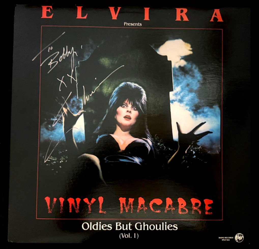 The “Elvira Presents Vinyl Macabre” album cover signed & inscribed by Elvira