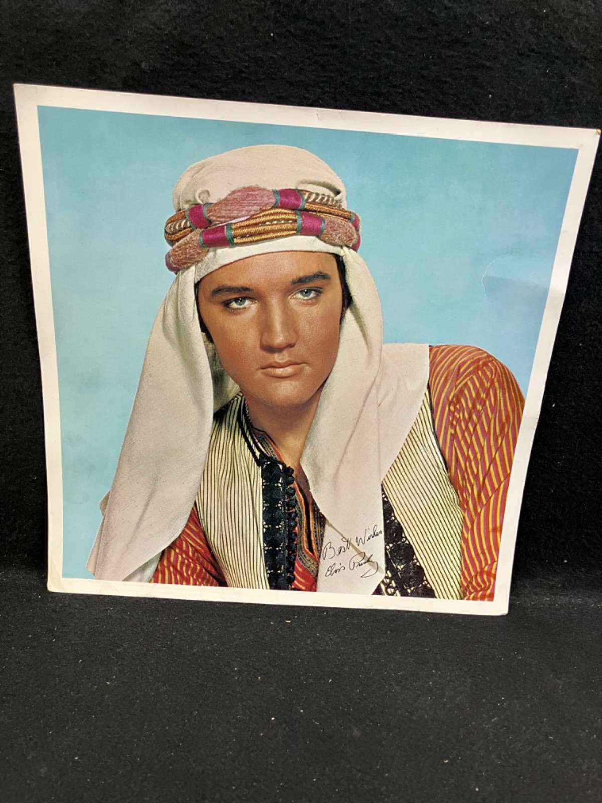 1965 ELVIS PRESLEY IN “HARUM SCARUM” MOVIE CLOSE UP PROMO PHOTO, 11.75″ X 11.75″
