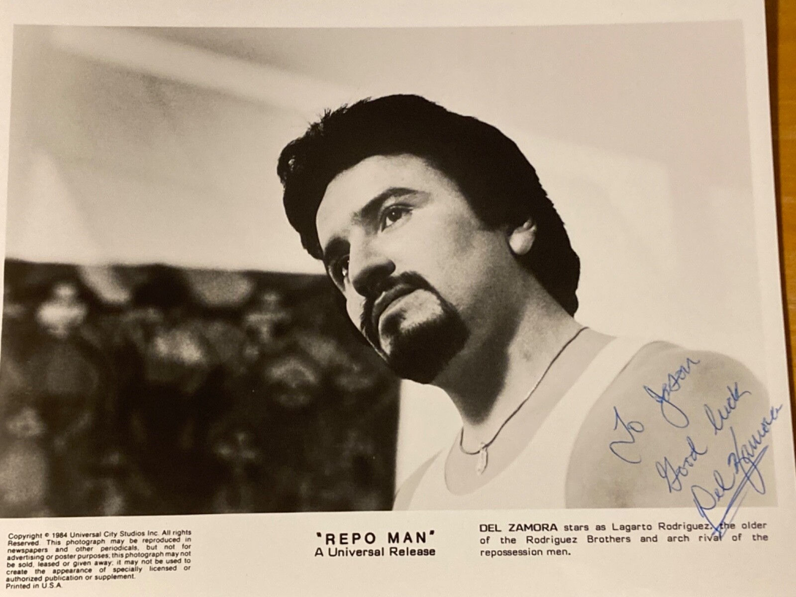 Hand SIGNED Del Zamora 10×8 Photo – Repo Man Movie Still – Universal